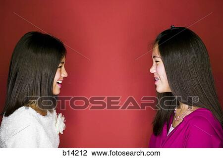 Stock Image - Sisters smiling. Fotosearch