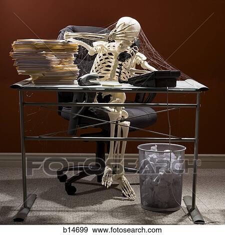 Skeleton sitting at desk talking on telephone with webs and stacks of paperwork View Large Photo Image Stock Photo - Skeleton sitting at desk talking on telephone with webs and stacks of paperwork. Fotosearch