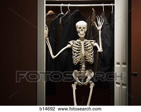 Skeleton standing in closet waving View Large Photo Image Stock Image - Skeleton standing in closet waving. Fotosearch