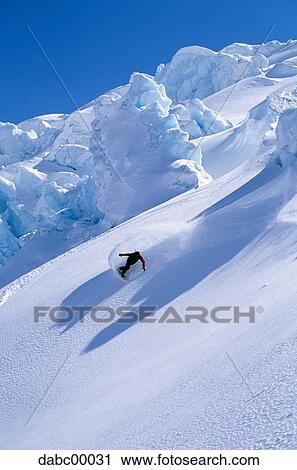 Snowboarder on mountain snowboarding View Large Photo Image Stock Image - Snowboarder on mountain snowboarding. Fotosearch