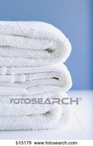 Stack of white towels View Large Photo Image Stock Photo - Stack of white towels. Fotosearch