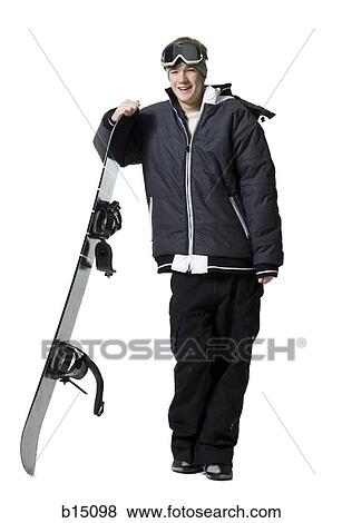 Teenage boy standing with snowboard and goggles View Large Photo Image Stock Photo - Teenage boy standing with snowboard and goggles. Fotosearch