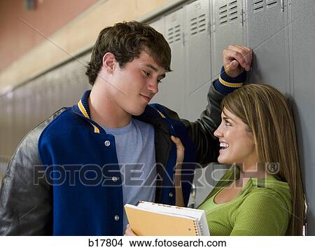 Picture - Teenage couple at school.. Fotosearch