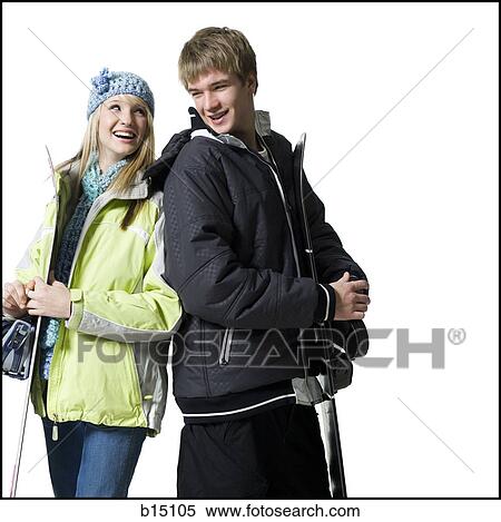 Teenage girl and boy with winter coats and skis smiling View Large Photo Image Stock Photography - Teenage girl and boy with winter coats and skis smiling. Fotosearch