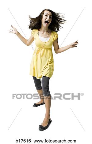 Teenage girl dancing and smiling View Large Photo Image Stock Photograph - Teenage girl dancing and smiling. Fotosearch