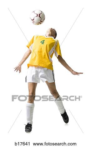 Teenage girl heading soccer ball View Large Photo Image Stock Image - Teenage girl heading soccer ball. Fotosearch