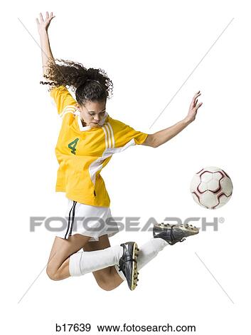 Teenage girl kicking soccer ball View Large Photo Image Stock Photo - Teenage girl kicking soccer ball. Fotosearch