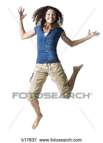 Teenage girl leaping and smiling View Large Photo Image Stock Photo - Teenage girl leaping and smiling. Fotosearch