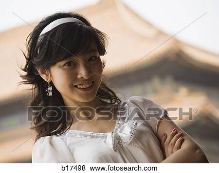 Teenage girl posing and smiling View Large Photo Image Stock Photo - Teenage girl posing and smiling. Fotosearch