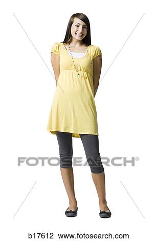 Teenage girl smiling and posing View Large Photo Image Stock Image - Teenage girl smiling and posing. Fotosearch