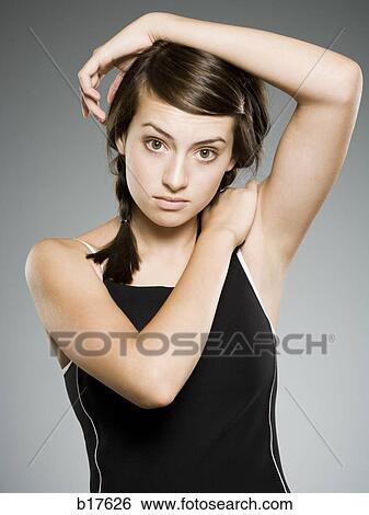 Teenage girl stretching arms View Large Photo Image Stock Photograph - Teenage girl stretching arms. Fotosearch