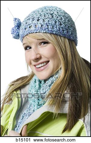 Teenage girl with hat and scarf smiling View Large Photo Image Stock Image - Teenage girl with hat and scarf smiling. Fotosearch