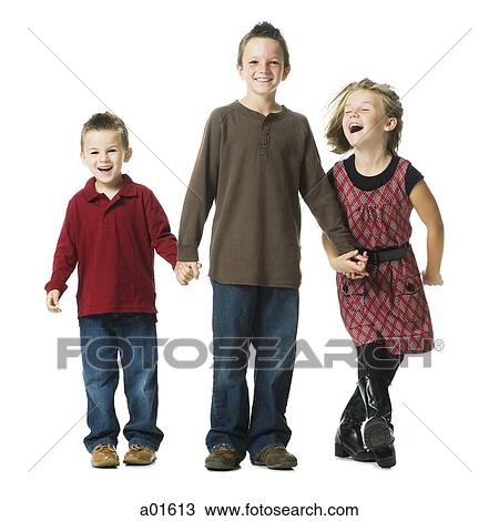 Three children holding hands and smiling View Large Photo Image Stock Image - Three children holding hands and smiling. Fotosearch