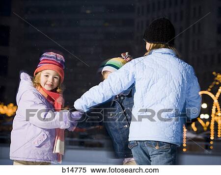 Stock Photography - Three girls outdoors in winter. Fotosearch