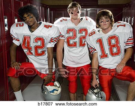 Stock Photo - Three High School football players.. Fotosearch