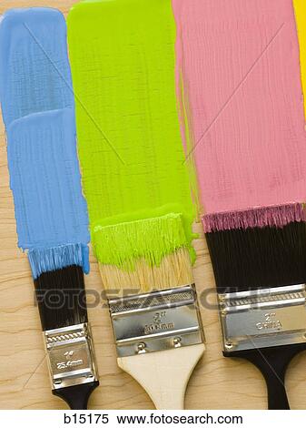 Stock Photography - Three paint brushes with stripes of paint. Fotosearch