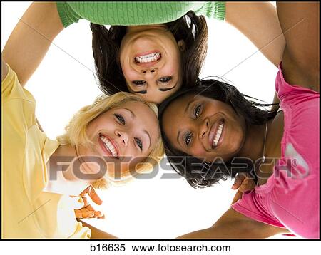 Three women hugging and smiling View Large Photo Image Stock Photography - Three women hugging and smiling. Fotosearch
