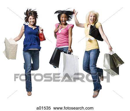 Three women jumping and smiling with shopping bags View Large Photo Image Stock Photography - Three women jumping and smiling with shopping bags. Fotosearch