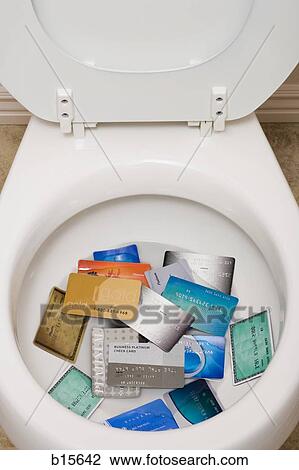 Toilet bowl with credit cards View Large Photo Image Stock Image - Toilet bowl with credit cards. Fotosearch