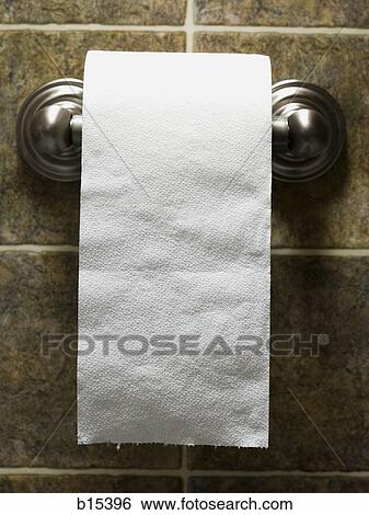 Toilet paper roll on bathroom wall View Large Photo Image Stock Photograph - Toilet paper roll on bathroom wall. Fotosearch