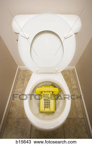 Toilet with old fashioned telephone View Large Photo Image Stock Image - Toilet with old fashioned telephone. Fotosearch