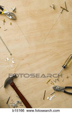 Tools and fasteners on hardwood floor View Large Photo Image Stock Photograph - Tools and fasteners on hardwood floor. Fotosearch