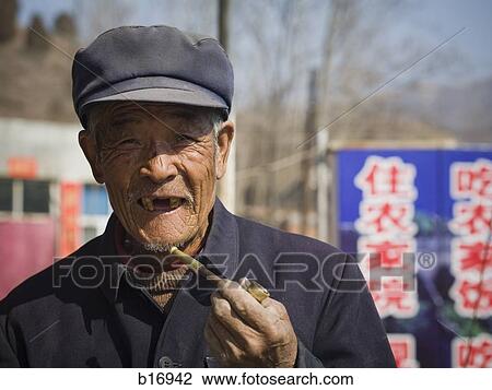 Toothless man with cap and pipe smiling outdoors View Large Photo Image Stock Image - Toothless man with cap and pipe smiling outdoors. Fotosearch