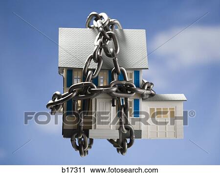 Toy house with chains and blue sky in background View Large Photo Image Stock Image - Toy house with chains and blue sky in background. Fotosearch