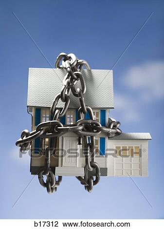 Toy house with chains and blue sky in background View Large Photo Image Stock Image - Toy house with chains and blue sky in background. Fotosearch