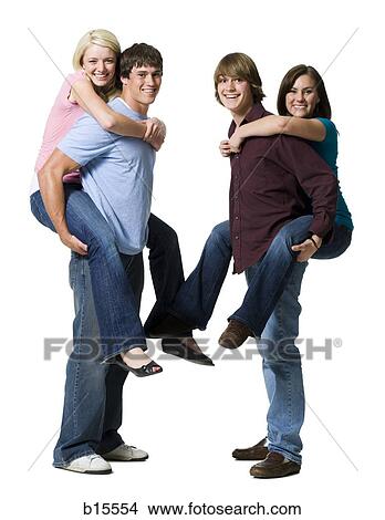 Two boys giving two girls piggy back rides View Large Photo Image Picture - Two boys giving two girls piggy back rides. Fotosearch