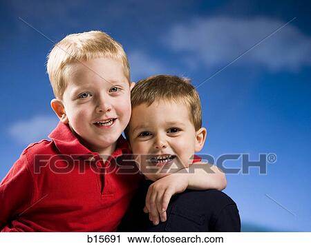 Two boys hugging View Large Photo Image Stock Image - Two boys hugging. Fotosearch
