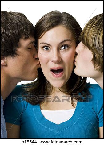 Two boys kissing girl on cheeks View Large Photo Image Picture - Two boys kissing girl on cheeks. Fotosearch
