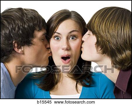 Two boys kissing girl on cheeks View Large Photo Image Stock Photography - Two boys kissing girl on cheeks. Fotosearch