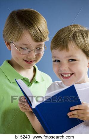 Two boys reading book View Large Photo Image Stock Image - Two boys reading book. Fotosearch