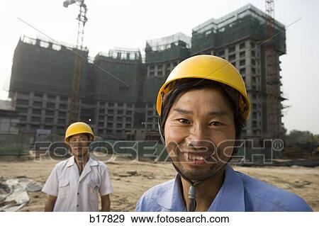 Two construction workers on the job site. View Large Photo Image Stock Photo - Two construction workers on the job site.. Fotosearch