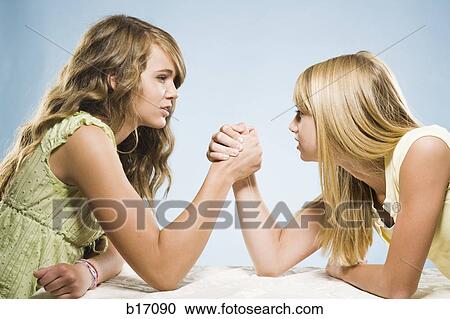 Two girls arm wrestling View Large Photo Image Stock Image - Two girls arm wrestling. Fotosearch