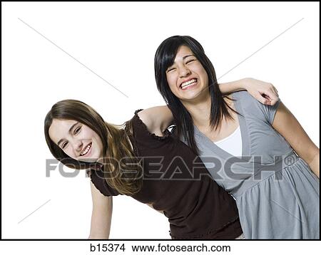 Two girls hugging and laughing View Large Photo Image Picture - Two girls hugging and laughing. Fotosearch