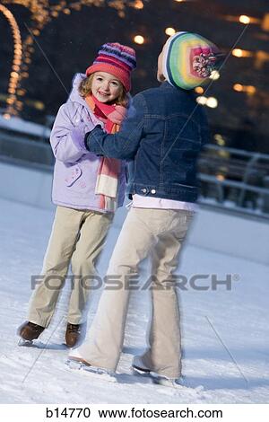 Two girls outdoors in winter smiling View Large Photo Image Stock Image - Two girls outdoors in winter smiling. Fotosearch