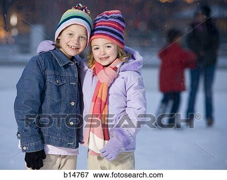 Two girls outdoors in winter smiling View Large Photo Image Stock Photo - Two girls outdoors in winter smiling. Fotosearch