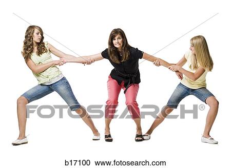 Two girls pulling mother's arms in both directions View Large Photo Image Stock Image - Two girls pulling mother's arms in both directions. Fotosearch