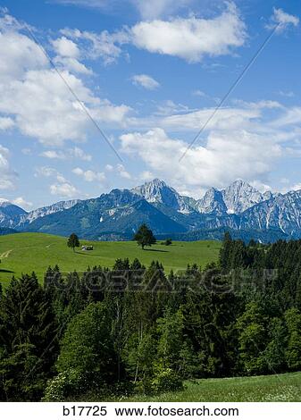Valley and mountains with blue sky and clouds View Large Photo Image Stock Photography - Valley and mountains with blue sky and clouds. Fotosearch