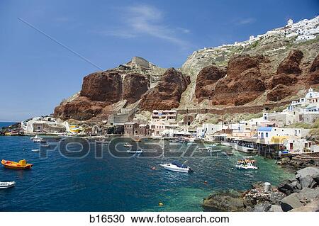 Village on rock formation with boats in water View Large Photo Image Stock Image - Village on rock formation with boats in water. Fotosearch