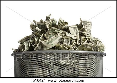 Picture - Waste paper basket with crumpled money. Fotosearch