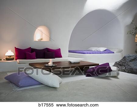 White room with throw pillows sofa and bed with rock inside View Large Photo Image Stock Photography - White room with throw pillows sofa and bed with rock inside. Fotosearch