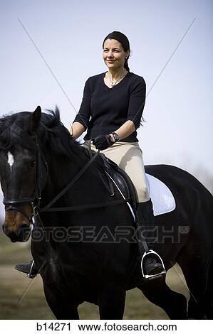 Stock Image - Woman and horse. Fotosearch