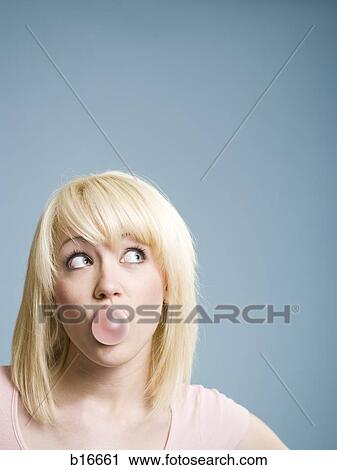 Woman blowing bubbles with chewing gum View Large Photo Image Stock Image - Woman blowing bubbles with chewing gum. Fotosearch