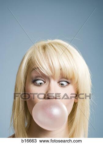 Woman blowing bubbles with chewing gum View Large Photo Image Stock Image - Woman blowing bubbles with chewing gum. Fotosearch