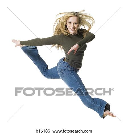 Stock Photograph - Woman dancing and smiling. Fotosearch