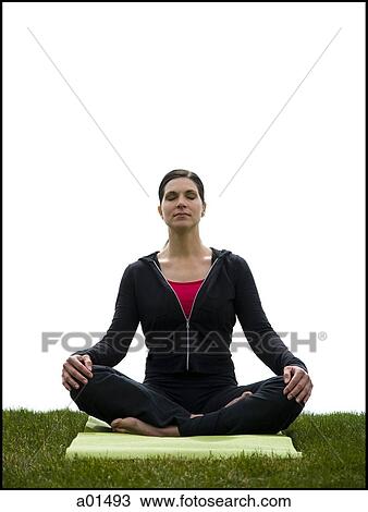 Woman doing yoga on mat on grass View Large Photo Image Stock Image - Woman doing yoga on mat on grass. Fotosearch