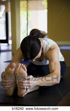 Woman doing yoga View Large Photo Image Stock Image - Woman doing yoga. Fotosearch